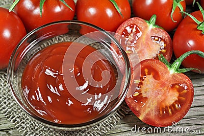 Fresh red tomatoes and ketchup Stock Photo
