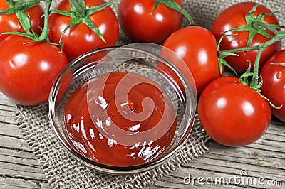 Fresh red tomatoes and ketchup Stock Photo