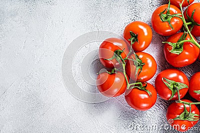 Fresh red tomatoes on kitchen table. White background. Top view. Copy space Stock Photo