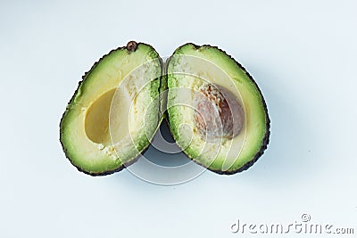 Fresh ripe avocado on a white background. Healthly food. Green vegetables Stock Photo