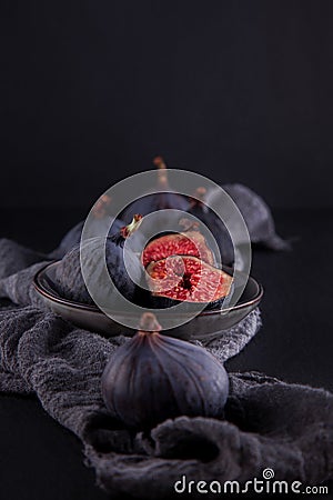 Fresh ripe figs, rustic food photography on slate plate kitchen table Stock Photo