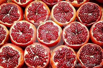 Fresh ripe half cut pomegranates . Stock Photo