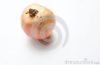 a Fresh ripe red Pomegranate, (Punica granatum) with green leaf isolated on white backdrop. Stock Photo