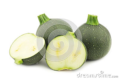 Fresh round zucchini's and a cut one Stock Photo