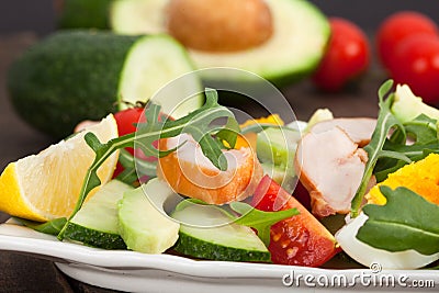 Fresh salad with chicken, tomatoes, rucola and avocado Stock Photo