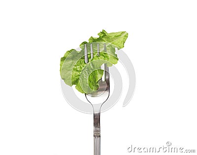 Fresh salad on a fork. Isolated. Concept of healthy diet and clean eating, balanced nutrition, weight loss. Vegetables on a fork. Stock Photo