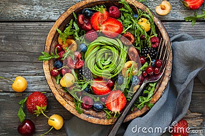 Fresh salad with fruit,berry and vegetables. Stock Photo