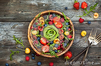 Fresh salad with fruit,berry and vegetables. Stock Photo