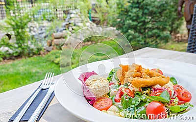 Fresh salad at a garden restaurant Stock Photo