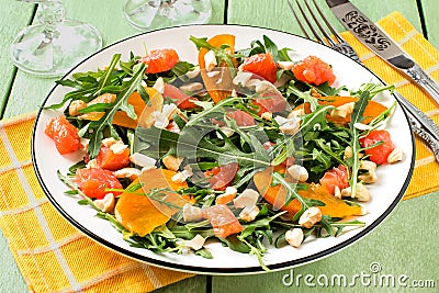 Fresh salad with salmon and persimmon Stock Photo