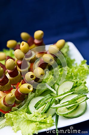 Fresh salad and skewered olives Stock Photo