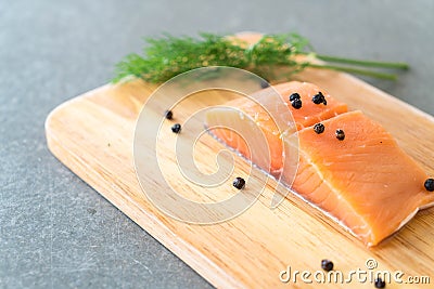 Fresh Salmon Fillet on board Stock Photo