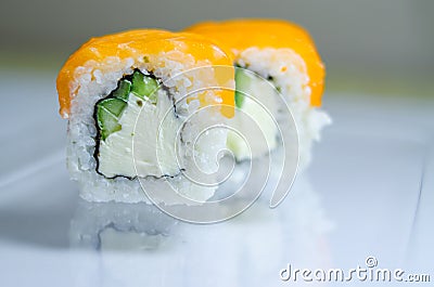 Fresh salmon philadelphia rolls. Smoked salmon rolls. Set of rolls on the board, table. One piece of roll. Food delivery, sushi. A Stock Photo
