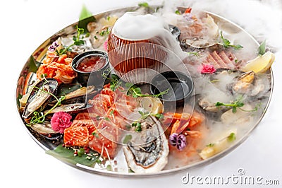 Fresh seafood plate with mussels, oysters, scallop and tuna Stock Photo