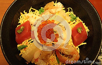 Fresh seafood and vegetables mixed traditional Chirashi sushi bowl Stock Photo