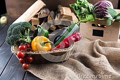 Fresh seasonal vegetables in basket on sackcloth Stock Photo