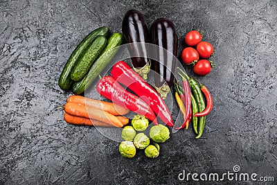 Fresh seasonal vegetables on black table top background Stock Photo