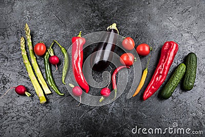 Fresh seasonal vegetables in row on black table top background Stock Photo