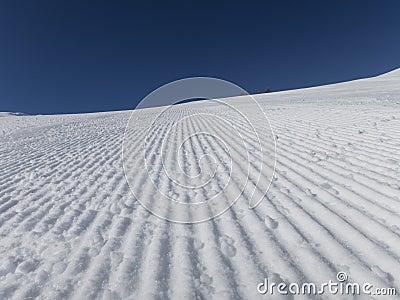 Fresh ski slopes early morning Stock Photo