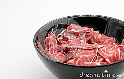Fresh sliced beef hind shank in black ceramic bowl Stock Photo