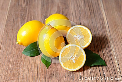 Fresh sliced lemons and leaves Stock Photo