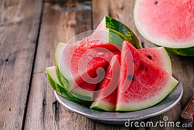 Fresh sliced watermelon on wooden rustic background Stock Photo