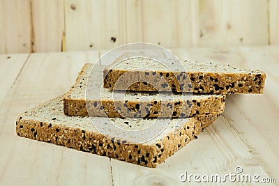 Fresh slices of wholewheat bread with various seeds and multigra Stock Photo