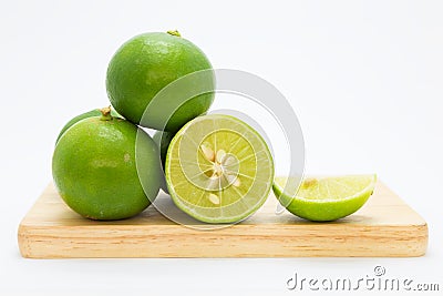 Fresh slide limes on wooden board Stock Photo