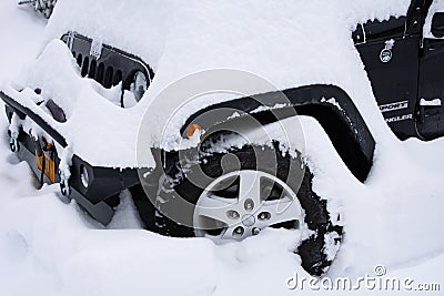 Fresh snow on black Jeep Editorial Stock Photo