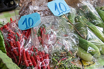 Fresh spice red chili with price on thai market Stock Photo