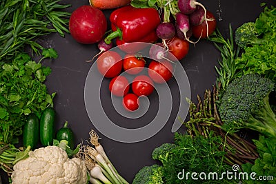 Fresh spring vegetables on black chalkboard Stock Photo