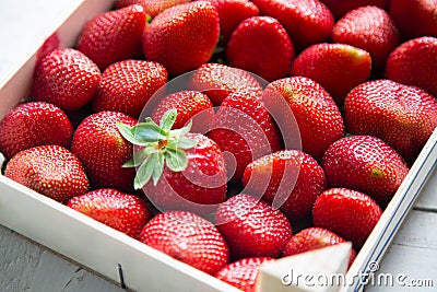 Fresh strawberries in a wooden box Stock Photo