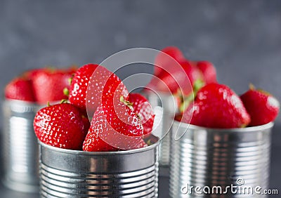 Fresh strawberry on gray background . Dessert with strawberries. Strawberries in the iron pot Stock Photo