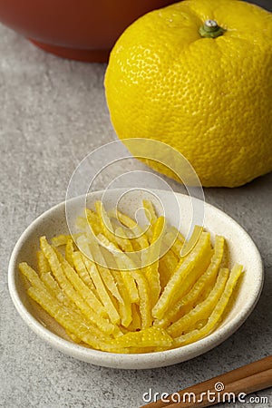 Fresh strips of a yellow Japanese Yuzu skin Stock Photo