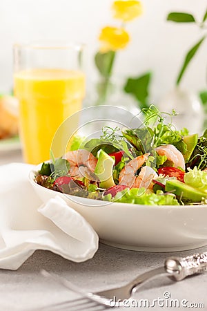 Fresh summer salad with shrimp, avocado and tomato Stock Photo