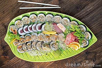 Fresh sushi on green platter Stock Photo