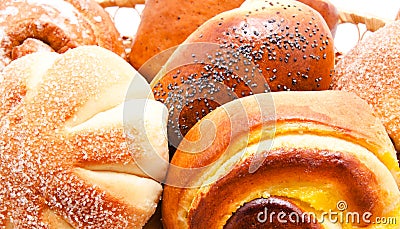 Fresh sweet buns and rolls with poppy and cream Stock Photo