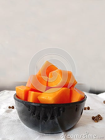 Fresh sweet papaya fruit pieces ina bowl Stock Photo
