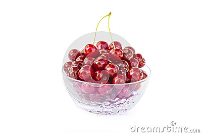 Fresh sweet red cherries in a glass bowl, ripe and juicy cherry fruit, healthy food, close-up, isolated on a white Stock Photo