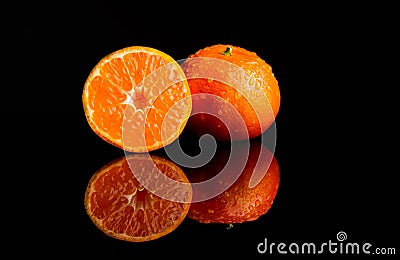 Fresh Tangerine with water splash cut Stock Photo