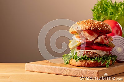 Fresh tasty burger on a wooden cutting board Stock Photo