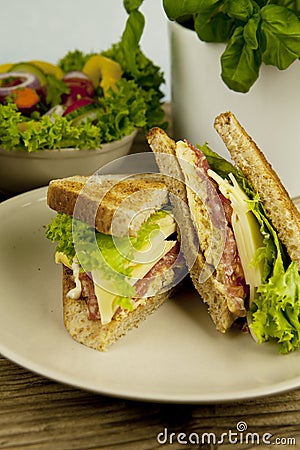 Fresh tasty club sandwich with cheese and ham on table Stock Photo