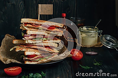 Fresh tasty club sandwich and sauces on the wooden dark table Stock Photo