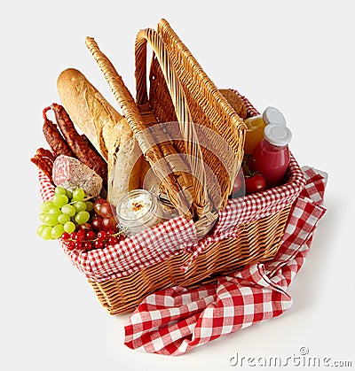 Fresh tasty food in a wicker picnic basket Stock Photo