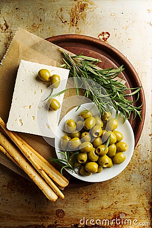 Fresh tasty greek green olives with cheese feta or goat cheese. Stock Photo