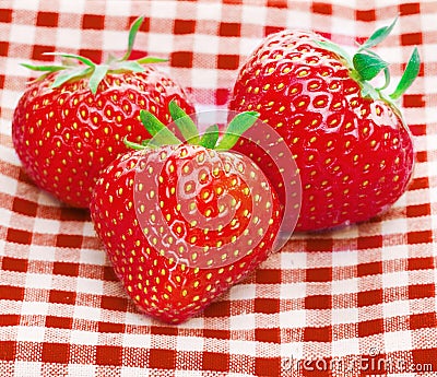 Fresh three strawberries Stock Photo