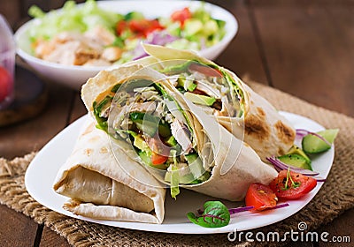 Fresh tortilla wraps with chicken and fresh vegetables Stock Photo