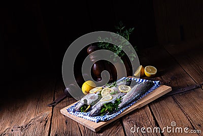 A fresh trout with lemon and different herbs Stock Photo