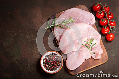 Fresh turkey meat steaks with rosemary, top view Stock Photo
