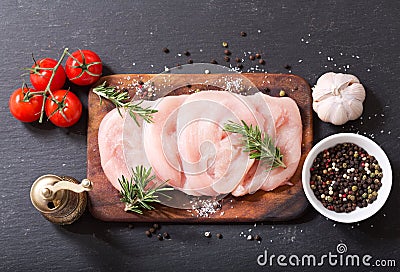 Fresh turkey meat on wooden board Stock Photo